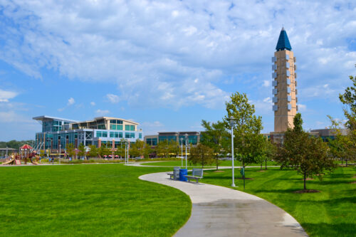 Situated in the heart of Omaha, Aksarben Village is a mixed-use redevelopment, incorporating the principles of new urbanism. Residential, office, retail, entertainment, and recreation all converge to make this project a positive addition to the Omaha metropolitan community. Lamp Rynearson was a key consultant to the owner in the development of Aksarben Village. Our responsibilities included infrastructure feasibility studies, platting, demolition and site grading, design and construction administration for storm sewers, and paving and utility coordination. Lamp Rynearson delivered on large and complex tasks including hydrologic/hydraulic analysis of the Papillion Creek, and the design of the trunk sewers and outlet structures.